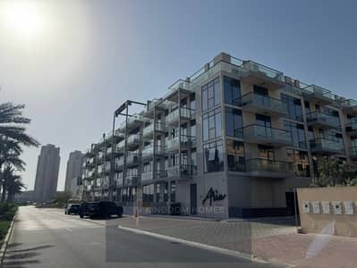 1 Slaapkamer Appartement te Huur in Jumeirah Village Circle (JVC), Dubai - 01_Exterior-Hero. jpg