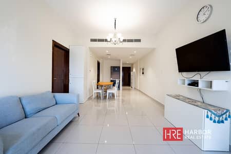 1 Bedroom Flat for Rent in Dubai Land Residence Complex (DLRC), Dubai - Closed Kitchen l High Floor l Fully Furnished