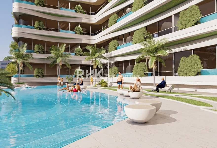 5 Landscaped courtyard pool with palm trees and outdoor seating at luxury apartment complex in Dubai
