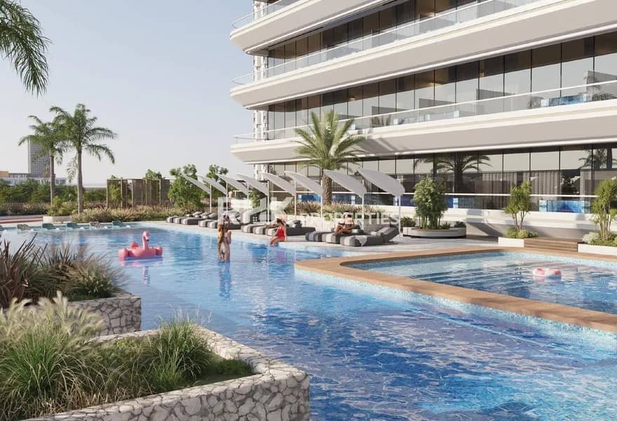 6 Infinity swimming pool with sunbeds and tropical landscaping at upscale Dubai residential community