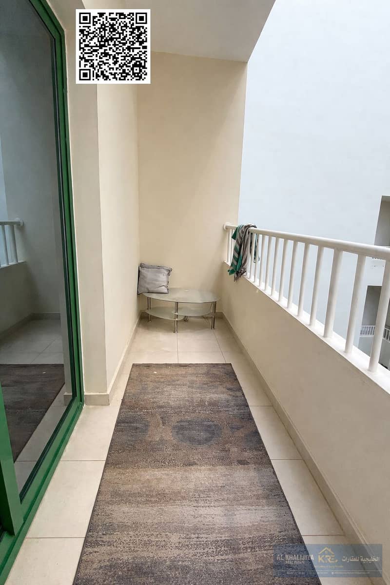 2 Clean balcony with textured area rug. png