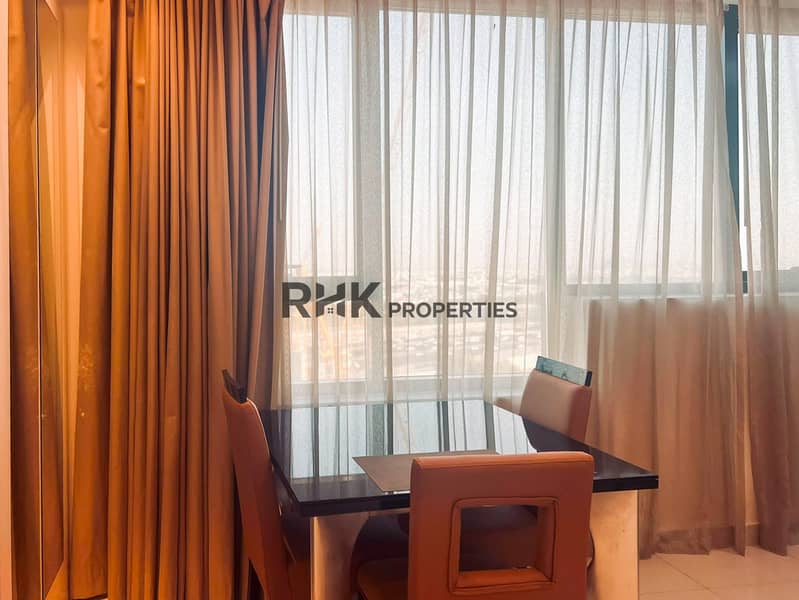 4 Dining area with city view in furnished Dubai apartment high floor
