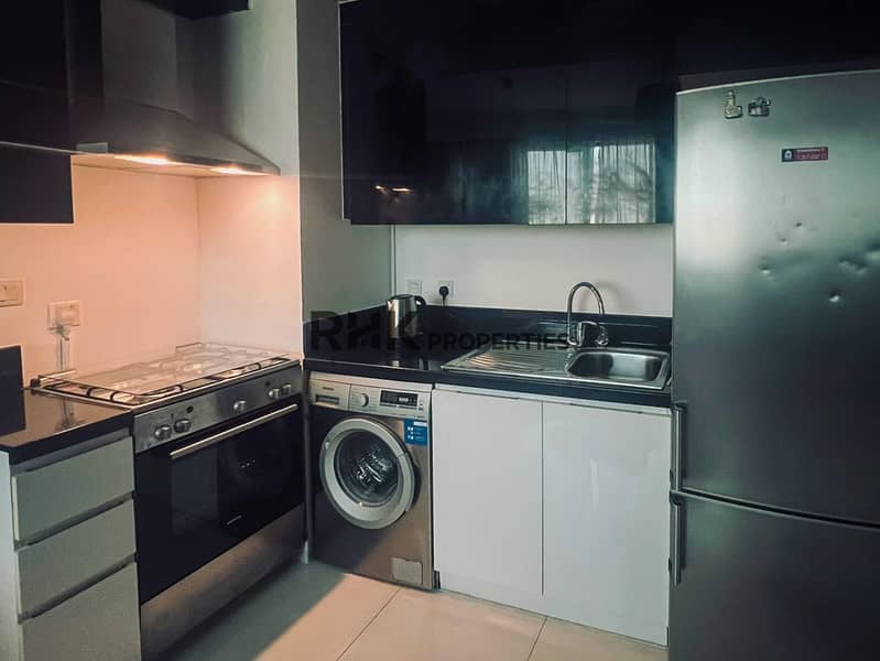 7 Fully equipped kitchen with gas oven washing machine and fridge Dubai apartment rental