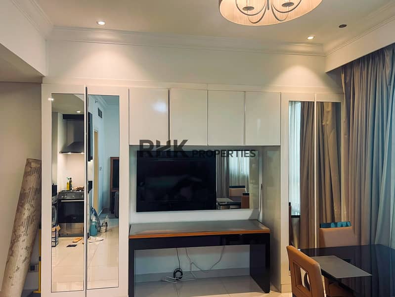 9 Built-in wardrobe with mirror and TV unit in furnished studio Dubai Silicon Oasis