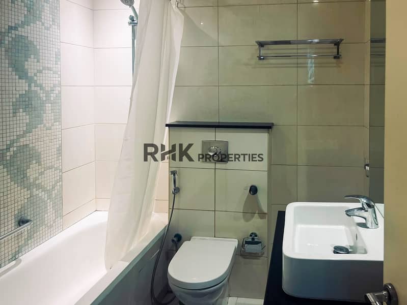 11 Modern bathroom with soaking tub shower and vessel sink Dubai furnished apartment