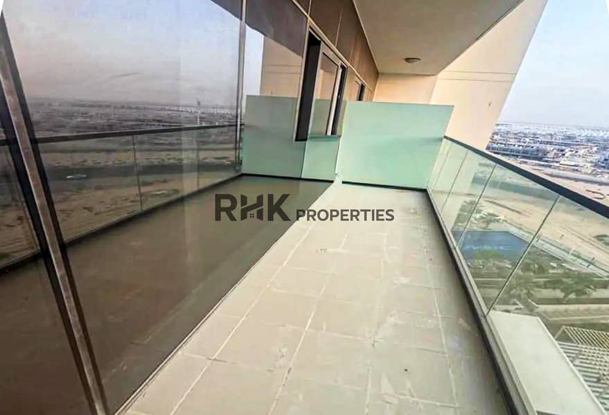 5 Spacious apartment balcony with glass railing and panoramic golf community views in Dubai
