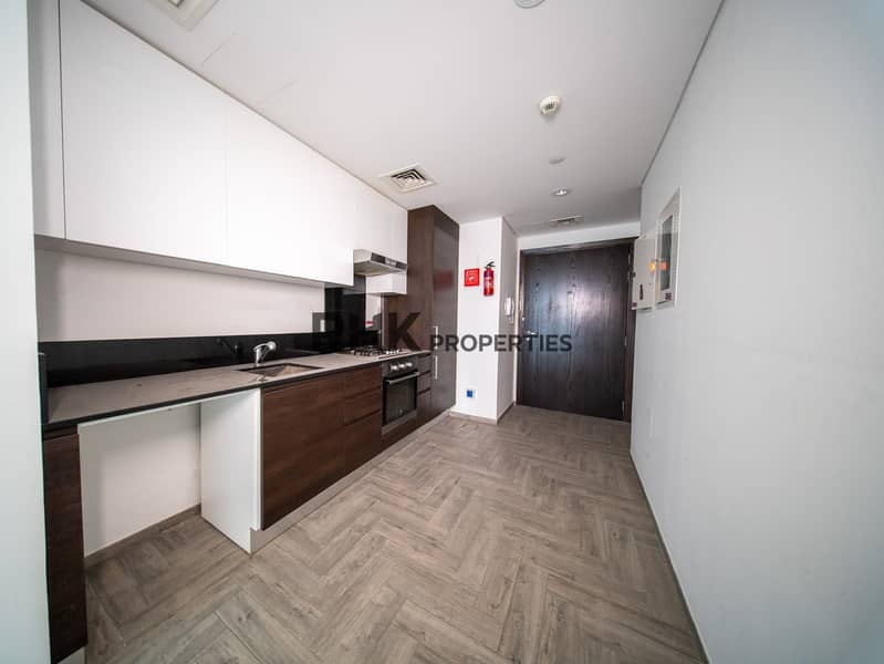 7 Modern open kitchen with built-in appliances, sleek cabinetry and contemporary finishes