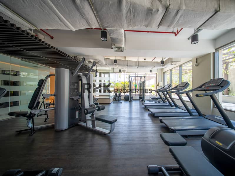 8 Luxury apartment gym with treadmills, weight machines and spacious fitness facilities