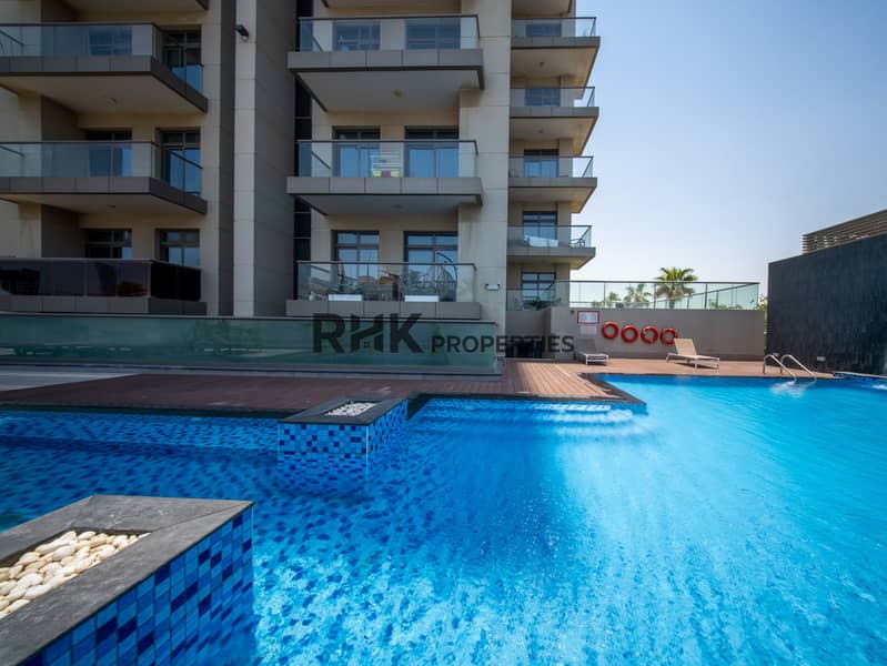 11 Modern apartment building with resort-style swimming pool, sun loungers and leisure facilities