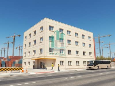 Labour Camp zum zur Miete in Al Jurf, Ajman - Realistic_exterior_architectural_view_of_a_staff_accommodation_building_similar_to_the_style_of_the_reference_image_a_modern_3_4_story_rectangular_dormitory_with_light_beige_off_white_exterior_panels_evenly_spaced_wi. jpeg