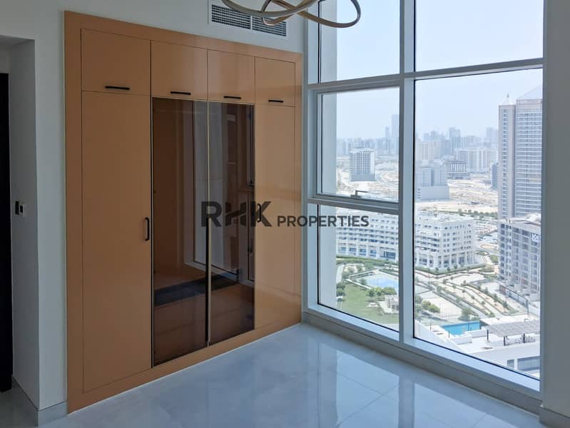 6 Master bedroom with built-in bronze wardrobe and panoramic Dubai city view from high floor