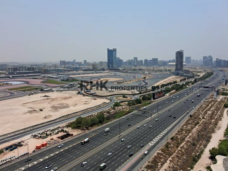 16 Aerial view of Dubai Autodrome and Sheikh Mohammed Bin Zayed Road from luxury apartment tower