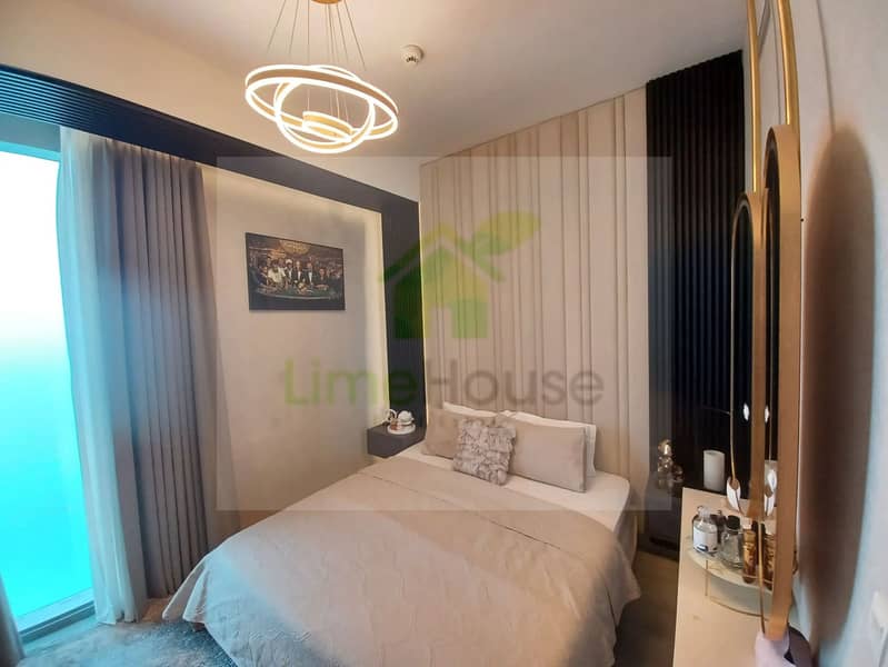 10 3-bedroom-apartment-5242-dubai-marina-bedroom-modern-chandelier-padded-headboard. webp