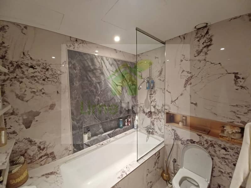 12 3-bedroom-apartment-5242-dubai-marina-bathroom-marble-finishes-bathtub-shower. webp