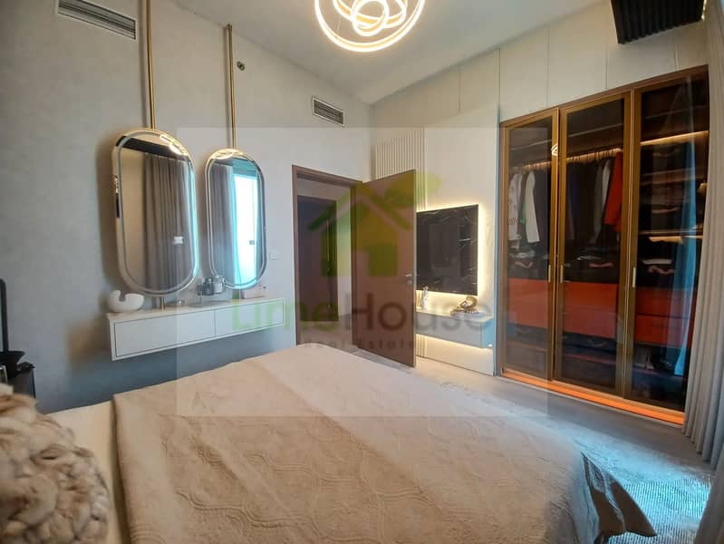 17 3-bedroom-apartment-5242-dubai-marina-bedroom-modern-light-dressing-table-wardrobe. webp