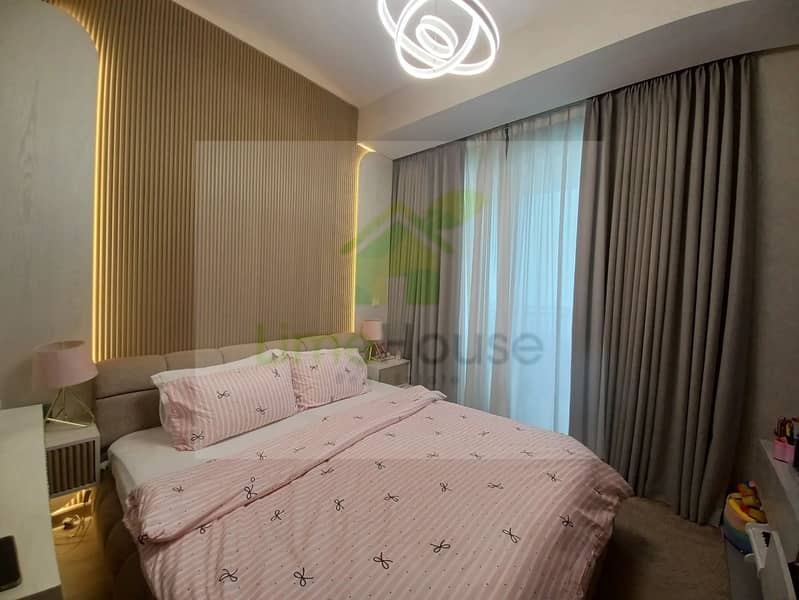 18 3-bedroom-apartment-5242-dubai-marina-bedroom-modern-light-wood-accent-wall. webp