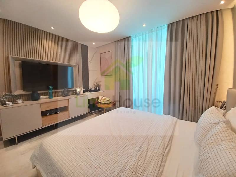 23 3-bedroom-apartment-5242-dubai-marina-bedroom-slatted-wall-tv-curtains-no-view. webp