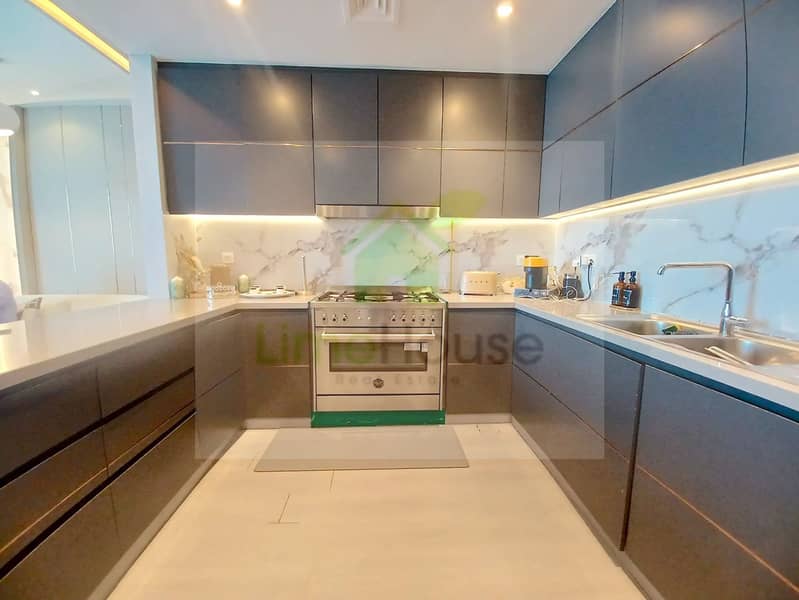 27 3-bedroom-apartment-5242-dubai-marina-kitchen-modern-cabinetry-marble-appliances. webp