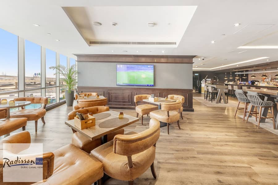 7 Radisson_UAE_CanalView_june2025_BaiBar_LR_3. jpg
