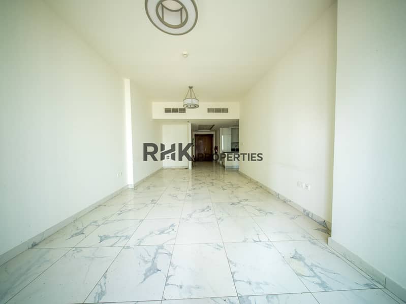 8 Bright spacious living room with marble tile flooring and open-plan layout in Dubai residential apartment