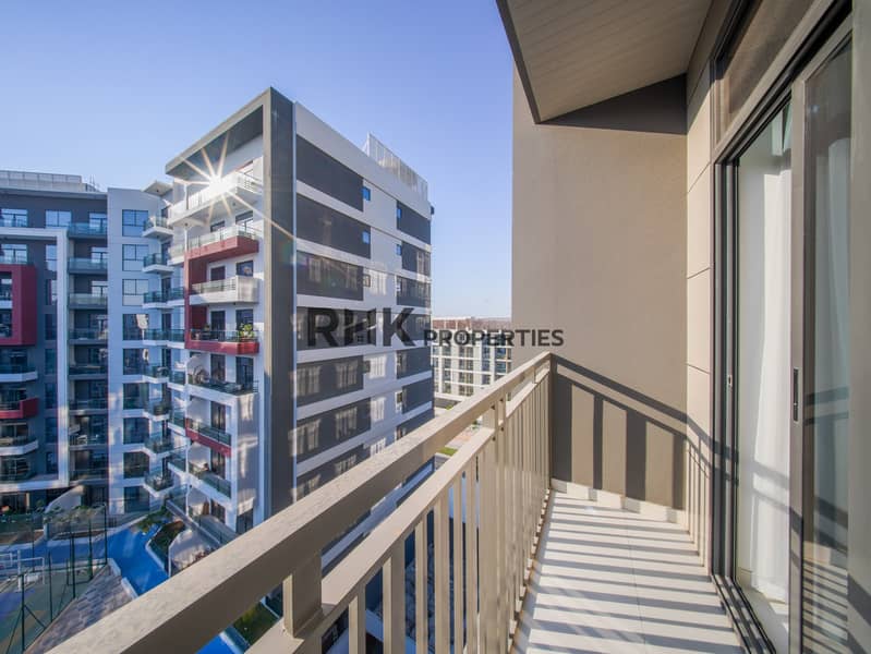 18 Studio apartment balcony with city and community views in Dubai residential tower