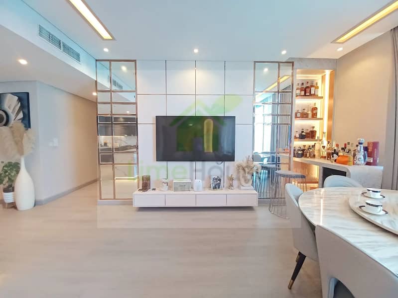 8 3-bedroom-apartment-5242-dubai-marina-living-room-integrated-bar-modern-tv-unit. webp