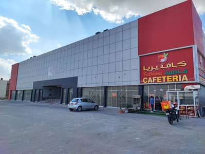 Showroom for Rent in Al Maqtaa, Umm Al Quwain - shop uaq mall Building (3). jpg