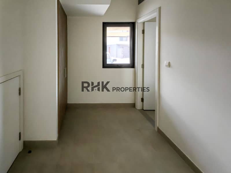 14 Compact bedroom with built-in wardrobe and en-suite bathroom access in Dubai townhouse