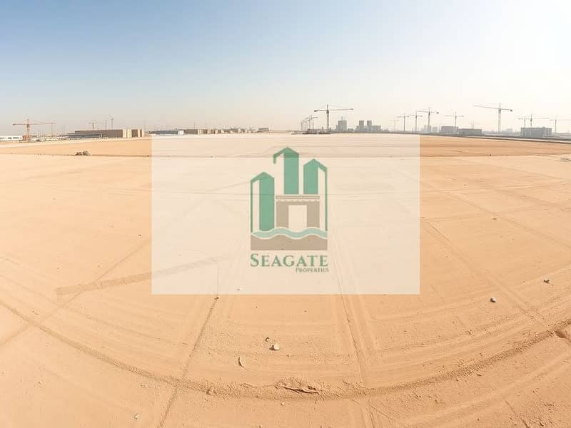 3 A_panoramic_view_of_an_empty_industrial_lot_in_the_UAE_showcasing_a_vast_flat_landscape_marked_for_future_development. _The_ground_is_sandy_and_dry_with_faint_markings_indicating_plot_boundaries. _In_the_distance_there. jpeg