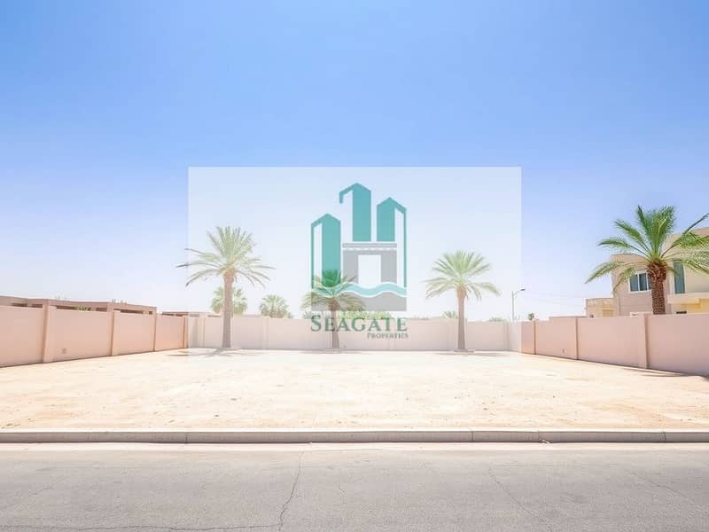 2 A_vacant_freehold_villa_plot_in_the_UAE_showcasing_a_spacious_area_of_land_that_is_flat_and_clear_ready_for_construction. _The_plot_has_a_few_palm_trees_and_is_bordered_by_a_clean_low_wall. _The_sky_is_bright_and_blue_. jpeg