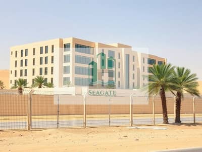 Labour Camp for Rent in Industrial Area, Sharjah - An_exterior_view_of_a_modern_labor_camp_in_the_UAE_featuring_a_large_multi_story_building_with_beige_colored_concrete_exterior_and_large_windows. _The_camp_is_surrounded_by_a_well_maintained_fence_with_a_desert_landsc. jpeg Labour Camp for Rent in Industrial Area, Sharjah - An_exterior_view_of_a_modern_labor_camp_in_the_UAE_featuring_a_large_multi_story_building_with_beige_colored_concrete_exterior_and_large_windows. _The_camp_is_surrounded_by_a_well_maintained_fence_with_a_desert_landsc. jpeg