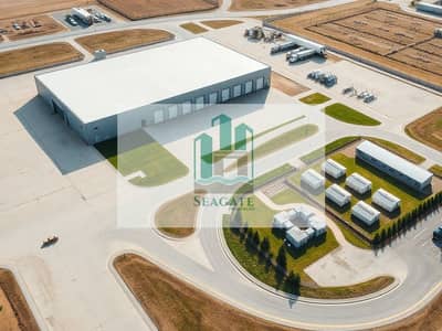 Warehouse zum zum Verkauf in Ajman Industrial, Ajman - A_realistic_wide_angle_aerial_exterior_view_of_a_complete_industrial_logistics_compound_similar_architectural_style_and_lighting_to_the_reference_one_large_rectangular_warehouse_building_with_light_gray_metal_siding_. jpeg Warehouse zum zum Verkauf in Ajman Industrial, Ajman - A_realistic_wide_angle_aerial_exterior_view_of_a_complete_industrial_logistics_compound_similar_architectural_style_and_lighting_to_the_reference_one_large_rectangular_warehouse_building_with_light_gray_metal_siding_. jpeg