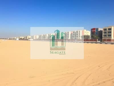 Участок Продажа в Аль Алиа, Аджман - A_large_empty_residential_plot_in_the_UAE_situated_one_block_from_a_road. _The_scene_features_an_expansive_flat_sandy_terrain_without_trees_or_signs_providing_an_open_unobstructed_view. _The_sky_is_bright_blue_typical_. jpeg Участок Продажа в Аль Алиа, Аджман - A_large_empty_residential_plot_in_the_UAE_situated_one_block_from_a_road. _The_scene_features_an_expansive_flat_sandy_terrain_without_trees_or_signs_providing_an_open_unobstructed_view. _The_sky_is_bright_blue_typical_. jpeg