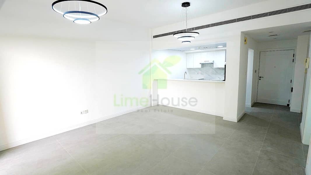 2 01-al-arta-4-greens-dubai-open-plan-living-kitchen-renovated-1br-apartment-rent. jpg