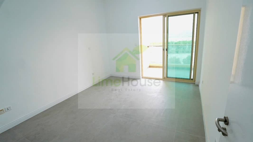 6 10-al-arta-4-greens-dubai-living-room-grey-tile-floor-1br-apartment-rent. jpg