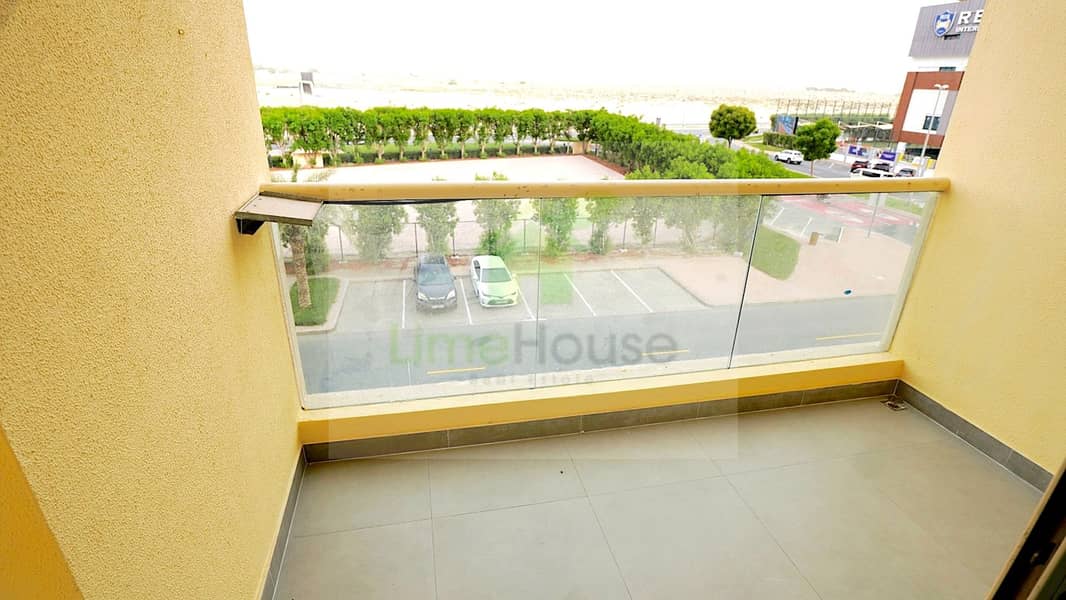 16 24-al-arta-4-greens-dubai-balcony-glass-railing-community-view-1br-apartment-rent. jpg