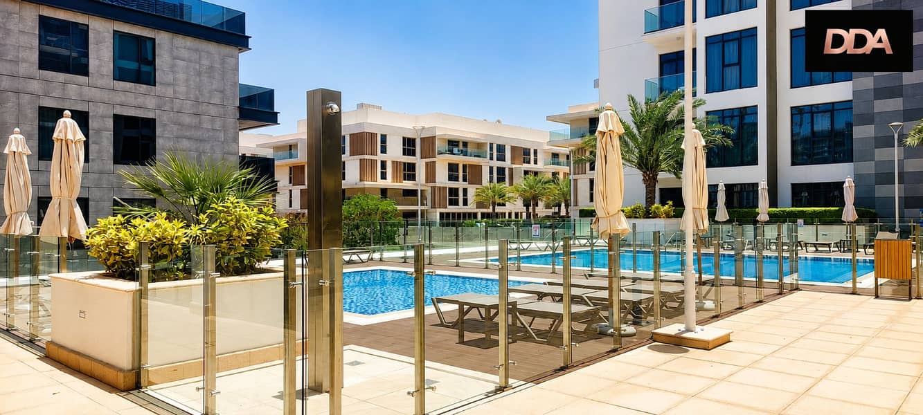 16 azizi-greenfield-poolside-lounge-area. png