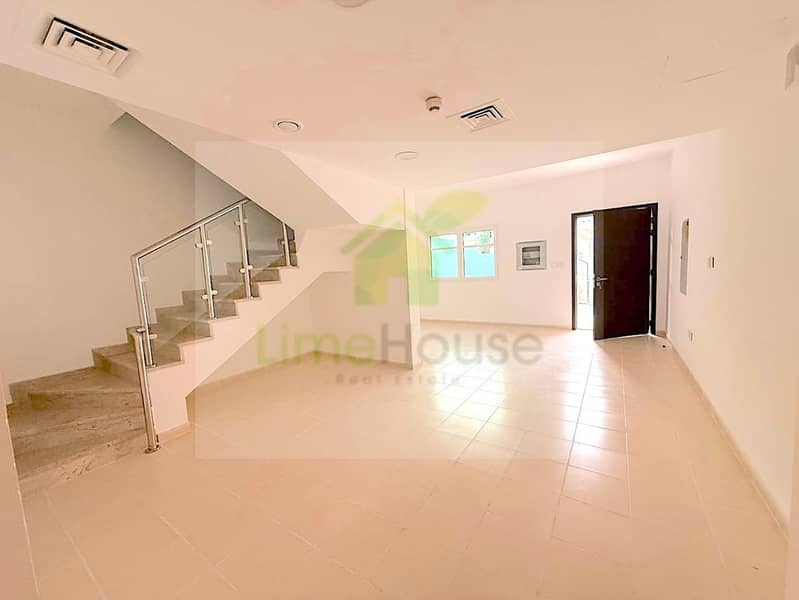2 seasons-community-jvc-townhouse-spacious-living-dining-area-staircase. jpg