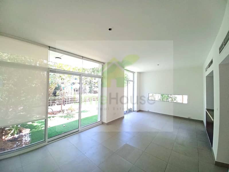 2 arabella-mudon-3-bedroom-semi-detached-villa-living-dining-area-garden-view-01. jpg