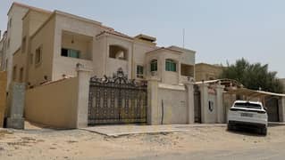 Villa for sale in Al Muwaihat 2 – Ajman | Prime location next to the mosque and on a main road and alley | 3,700 sq ft | Two floors + roof | 5 master