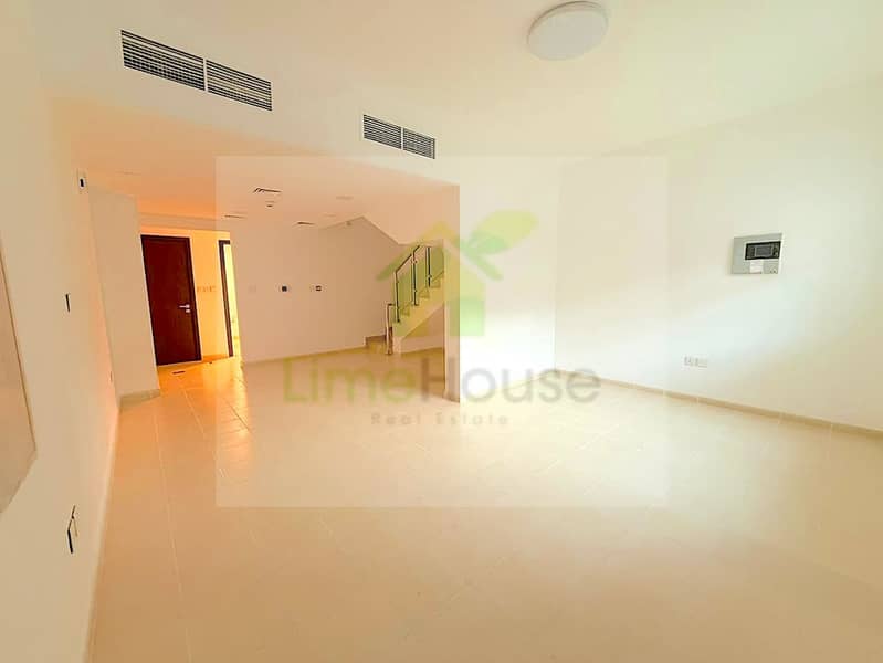 2 seasons-community-jvc-townhouse-open-plan-living-room-staircase. jpg