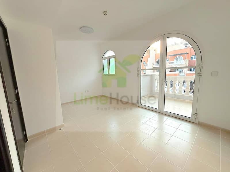 9 seasons-community-jvc-townhouse-bedroom-arched-balcony-community-view. jpg