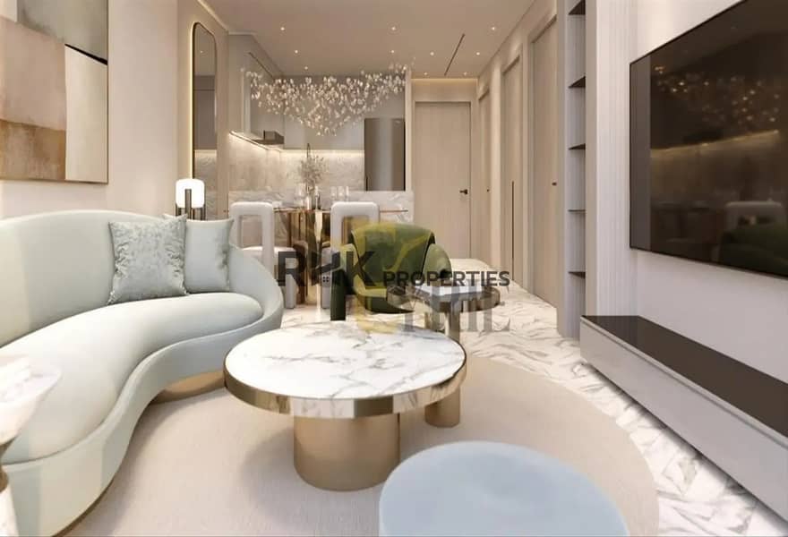 3 Open-plan luxury living room with curved white sofa, marble coffee table and gold accents in Red Square Dubai