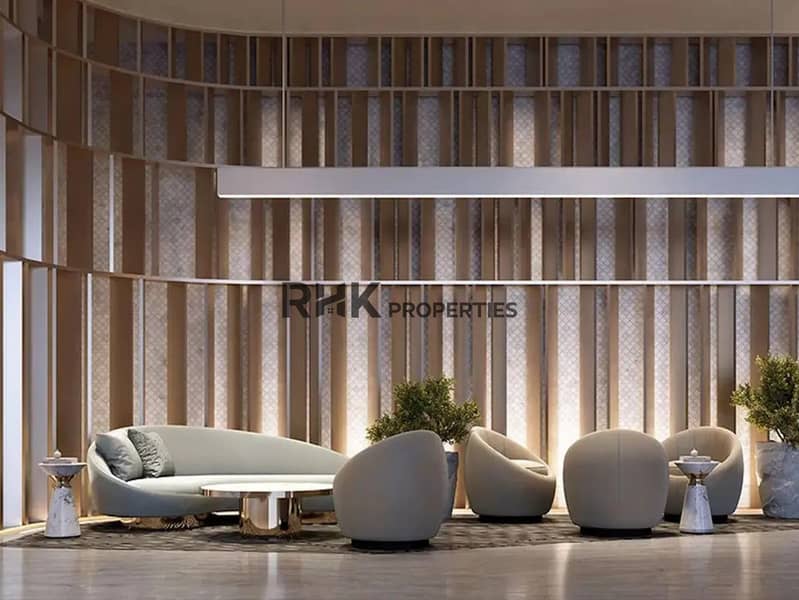 7 Luxury residents lounge with curved sofa, barrel chairs and textured wood panel wall in Red Square Dubai