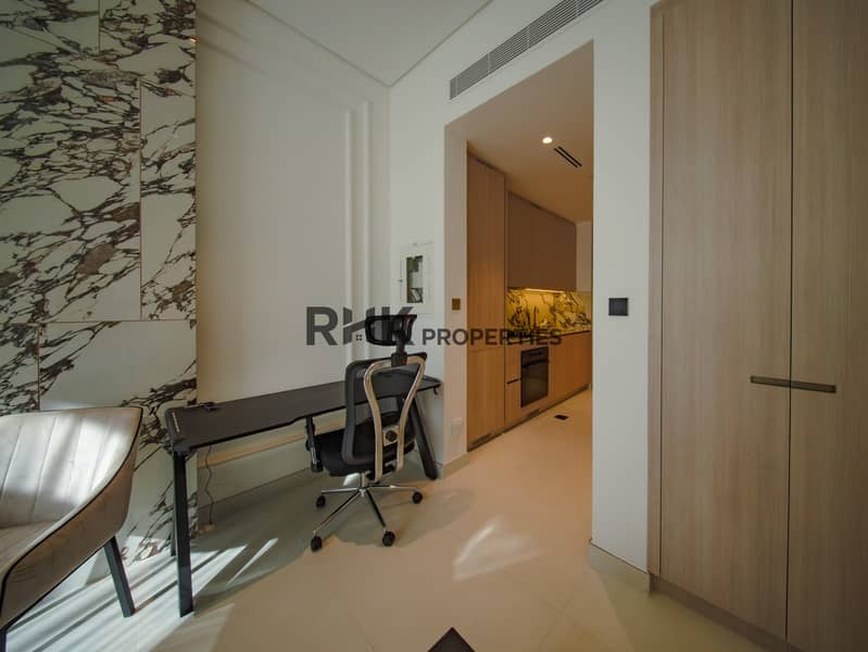 5 Studio apartment workspace and built-in wardrobe with modern kitchenette and luxury interior design