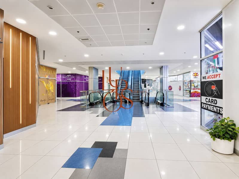 25 03_IT_Plaza_corridor_escalators_HD_4x3. jpg