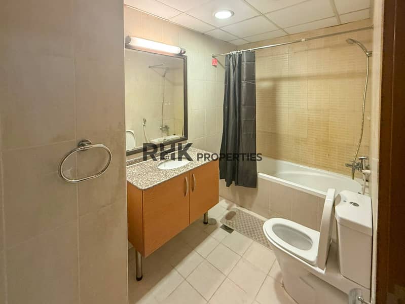 4 Furnished apartment bathroom with bathtub and granite vanity Suburbia Jebel Ali