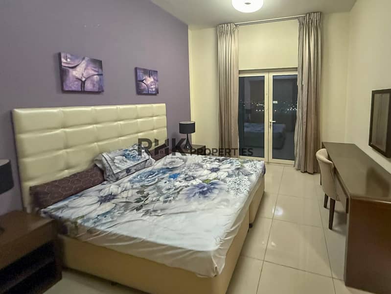 6 Furnished master bedroom work desk and balcony Suburbia B Jebel Ali Dubai