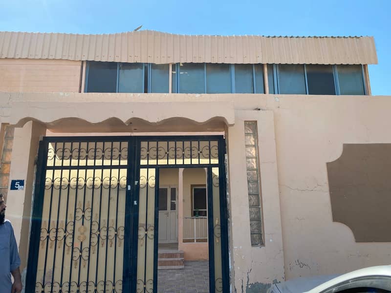 Two-storey villa for two families housing or investment in Al Ghafia