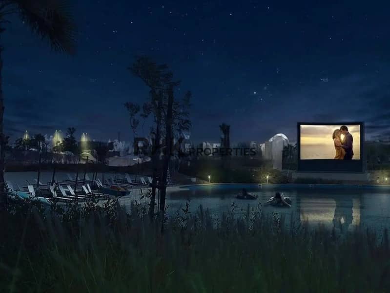 6 Outdoor floating cinema beside the lagoon pool at night in DAMAC community Dubai